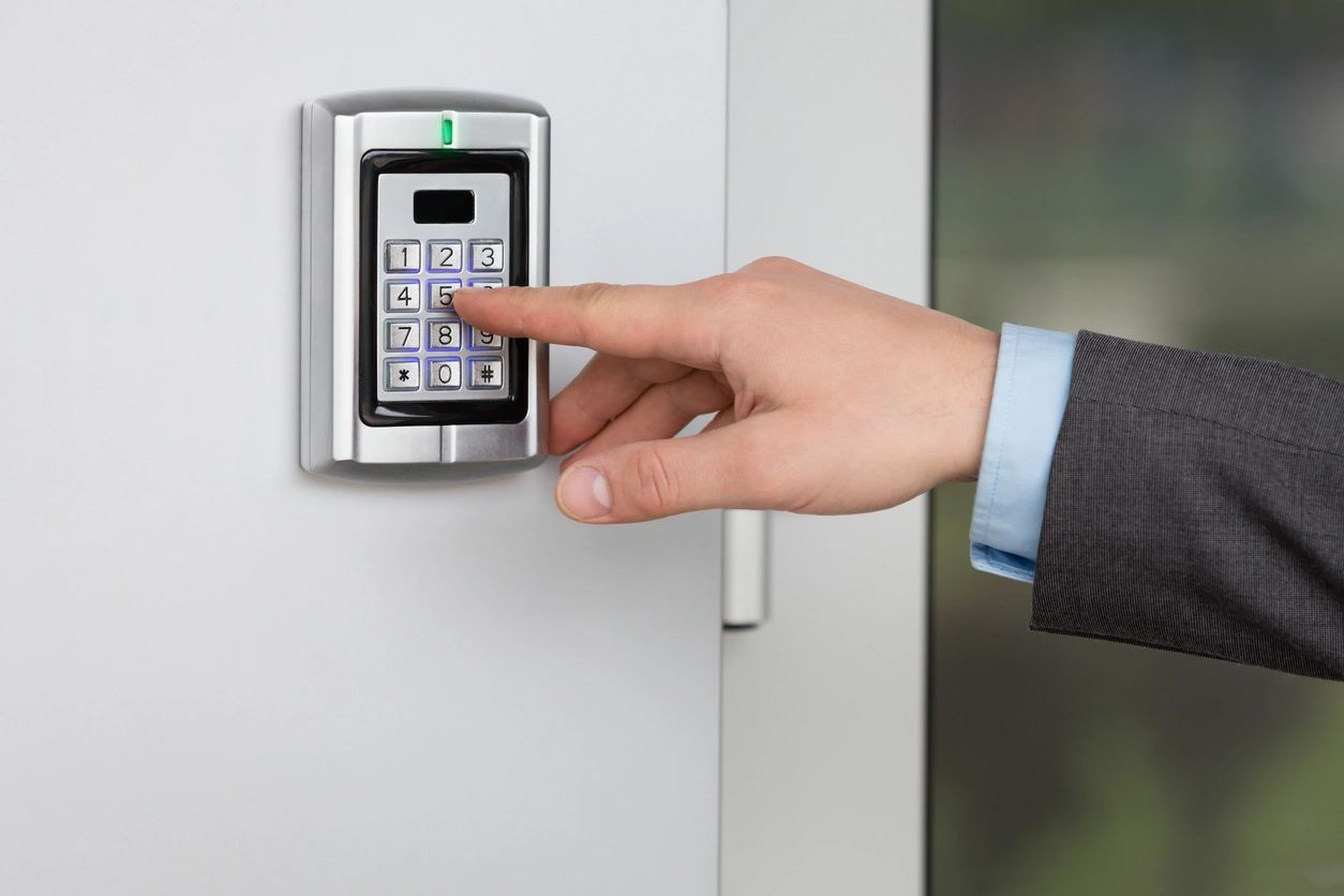 A person is using the electronic key to open the door.