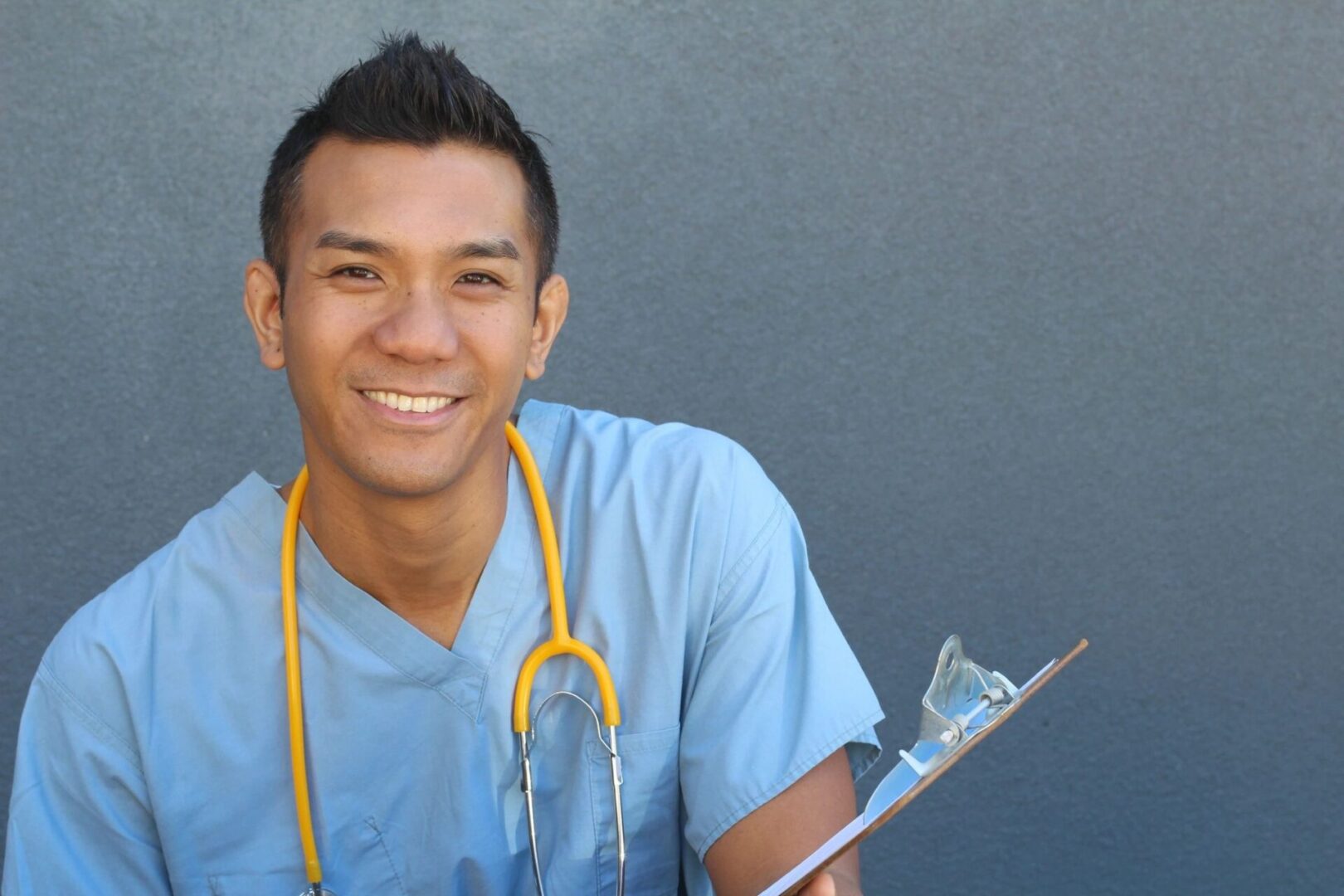 A health professional with a stethoscope, smiling